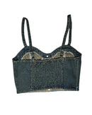 Denim crop top with suspenders on a white background