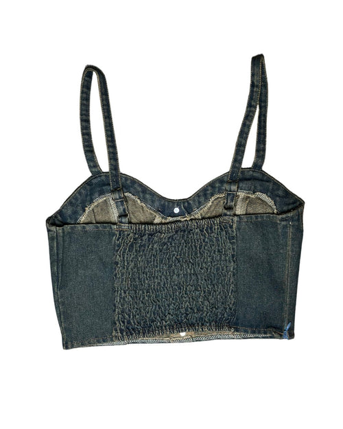 Denim crop top with suspenders on a white background