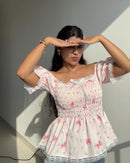 Bow Smocked Peplum Top